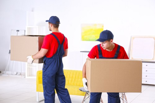 Professionals removing a sofa from a Radlett home