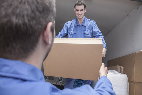 Professionals removing a sofa in Brentwood