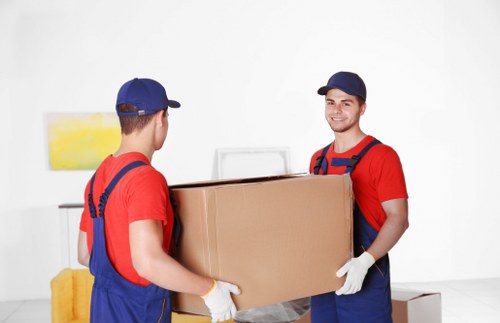 Professional sofa removal team in action in Harlow