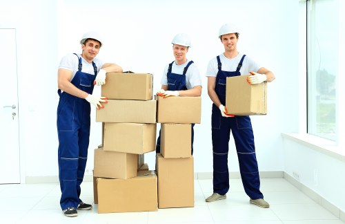 Team handling sofa collection and transportation