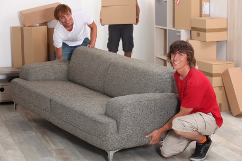 Preparing for sofa removal with measurements