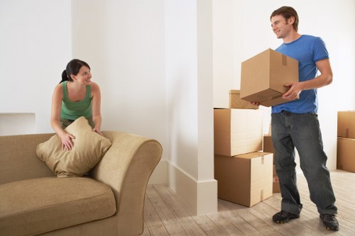 Technician assessing a sofa for removal