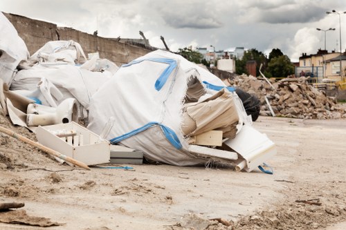Commercial office space with sofas being removed by professionals